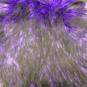 May include: Purple and black faux fur fabric with a soft, fluffy texture.