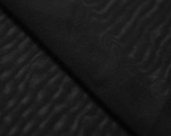 May include: Black sheer fabric with a textured, wavy pattern. The fabric is soft and lightweight.