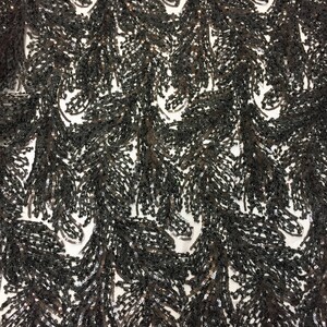 May include: Black sequined fabric with a feather design. The sequins are small and densely packed, creating a shimmering effect.