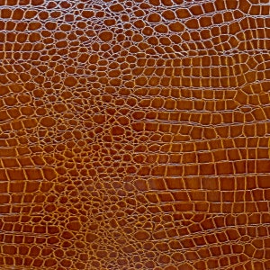 May include: Brown faux leather with a crocodile skin pattern.