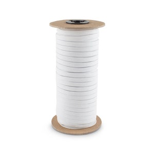 May include: A spool of white elastic cord wound around a cardboard tube.