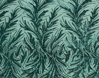 May include: A light mint green fabric featuring an intricate, repeating pattern of dark emerald green sequined leaves and branches. The sequins are densely applied, creating a textured, shimmering surface with a distinct botanical design.