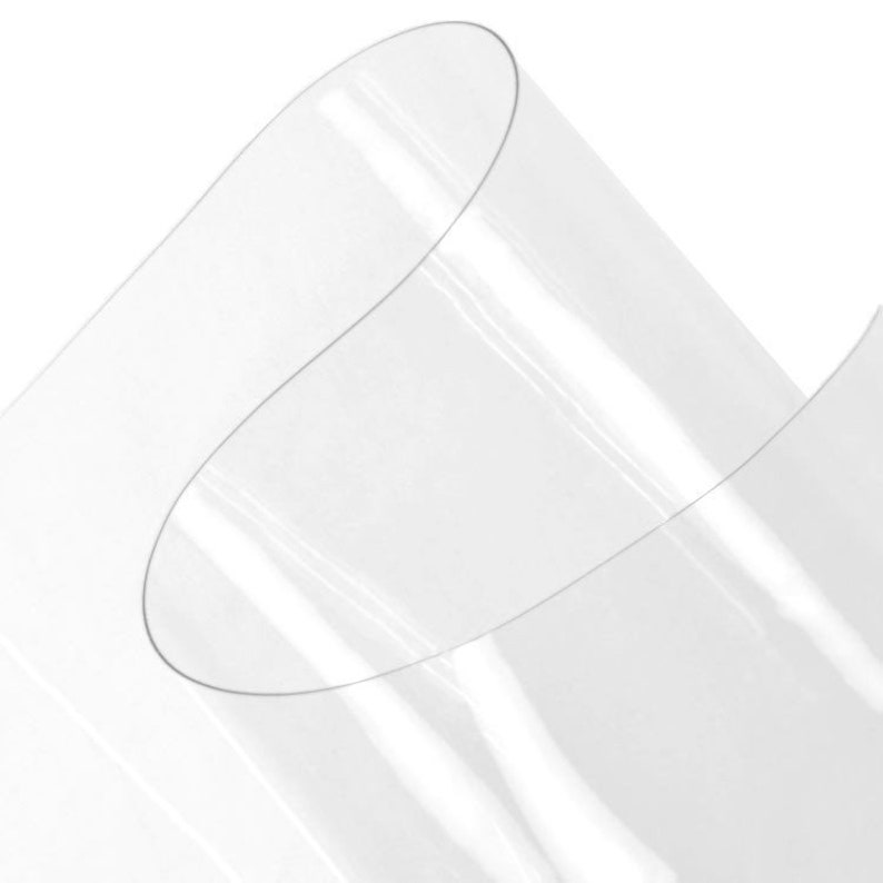 May include: Clear plastic sheet, rolled up and showing the smooth, transparent surface.