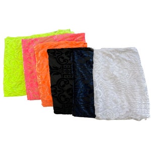 May include: Five pieces of fabric with an embossed pattern. The fabric is in the colors neon green, pink, orange, black, and white.