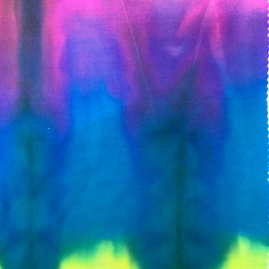 May include: A tie-dye fabric with a gradient of pink, purple, blue, and green colors. The fabric has a soft, smooth texture.