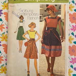 May include: A Simplicity 7574 sewing pattern envelope for size 8, featuring illustrations of three variations of a dress with a square neckline and tie-waist. The cover displays the text Young Contemporary Fashion and Tops Sized for Stretch Knits Only.