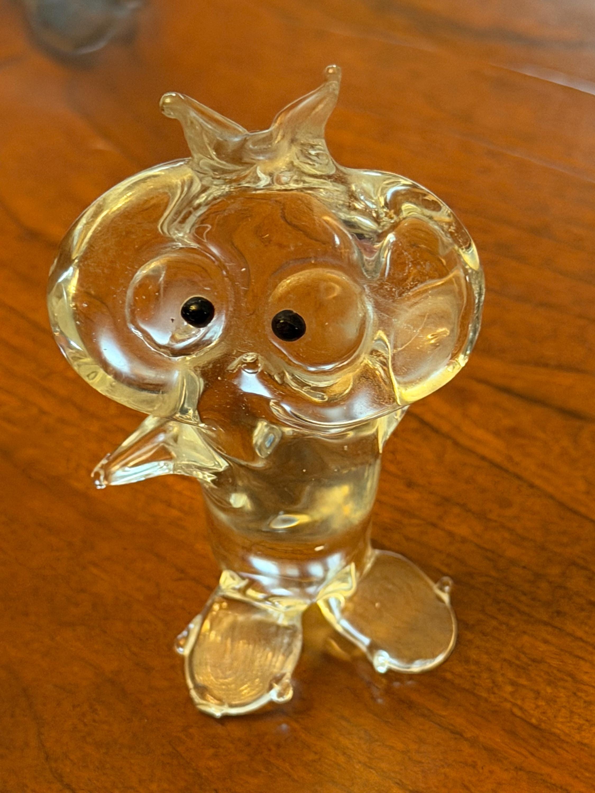 vintage hand-blown clear glass figurine of an owl with large, round eyes, small webbed or padded fee