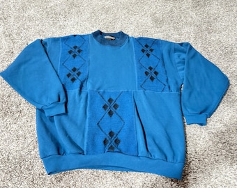 vintage Expressions International blue crewneck sweater from the 1990s, often referred to as a "grandpa sweater."