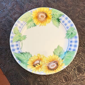 Corning Corelle salad plate features a discontinued "Sunsations" pattern with a blue gingham plaid border and yellow sunflowers.