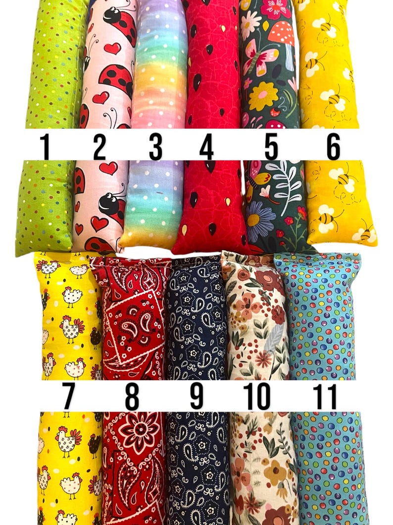May include: Eleven rectangular fabric pouches arranged in two rows, numbered 1 through 11. Patterns include green polka dots, ladybugs, rainbow gradients, red watermelon seeds, floral prints, yellow bees, chickens, red and blue paisley, and colorful dots.