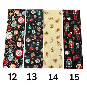 May include: Four rectangular fabric strips labeled 12 through 15. Strip 12 features holiday mugs and cookies on black. Strip 13 shows cocoa mugs and snowflakes on black. Strip 14 displays gingerbread men on beige. Strip 15 depicts nutcrackers on black.