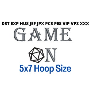 May include: An embroidered design in grey of the words "GAME ON" with a black and white 20-sided die in between the words. The text "5x7 Hoop Size" is below the design.