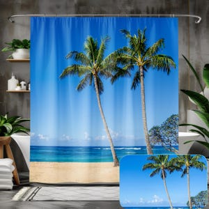 May include: A shower curtain featuring a tropical beach scene with two palm trees and a blue ocean. The curtain is made of polyester and is waterproof.