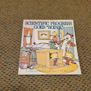 May include: A book cover featuring a cartoon illustration from the Calvin and Hobbes comic strip. The title reads "SCIENTIFIC PROGRESS GOES 'BOINK'". The artwork depicts Calvin and Hobbes in a room with a cardboard box.