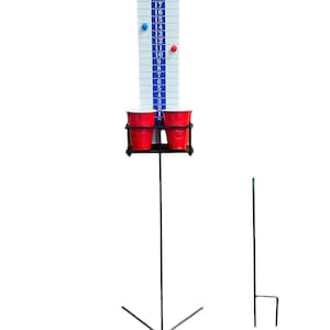 May include: A tall, white game board with blue and black markings, numbered from 1 to 21. Two red cups are held in a black metal frame. A blue and red magnet are attached to the board. The game is supported by a metal stand with an X-shaped base.