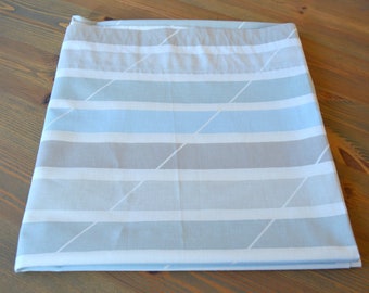 May include: A light blue and gray striped fabric with a white diamond pattern.