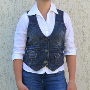 vest with blue jeans
