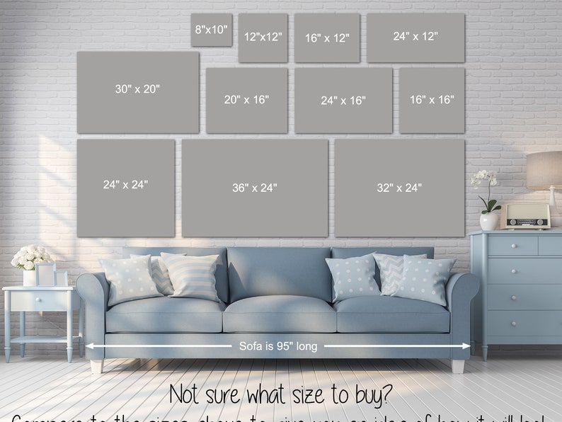 May include: A guide to choosing the right size canvas print for your living room. The image shows a grey sofa with a variety of canvas print sizes displayed on the wall behind it. The sofa is 95 inches long. The canvas print sizes range from 8 inches by 10 inches to 36 inches by 24 inches.