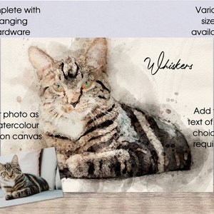 May include: Watercolor painting of a tabby cat on a canvas print. The cat is lying down with its head turned to the side. The painting is titled "Whiskers".