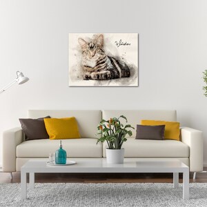 May include: A watercolor painting of a tabby cat with the word "Whiskers" written in cursive above the cat.