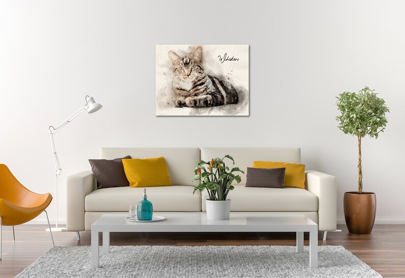 May include: A watercolor painting of a tabby cat with the word "Whiskers" written in cursive above the cat.