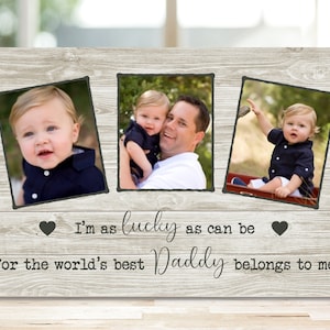 May include: A wood-grain background with three framed photos of a young child. The text "I'm as lucky as can be for the world's best Daddy belongs to me" is written below the photos.