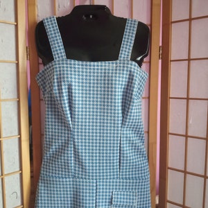 May include: A blue and white gingham sleeveless dress with a square neckline and a fitted bodice.