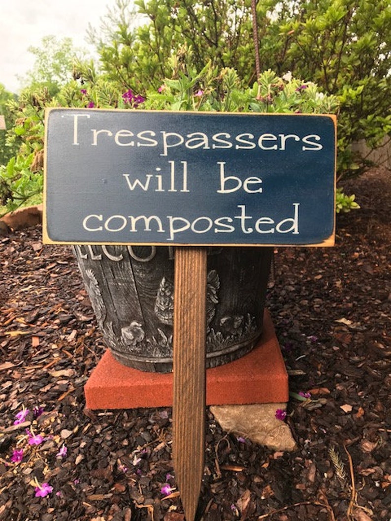 Trespassers will be composted garden stake sign image 1