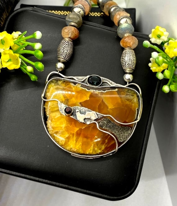 Artisan Ammonite Fossil Pendant Necklace: Sterling Silver, Garnet  display picture 1