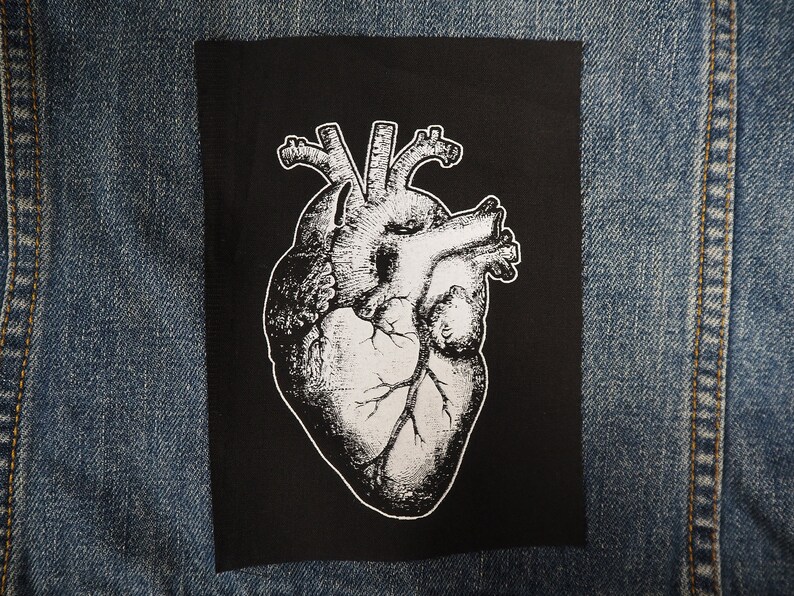 May include: A black and white anatomical heart illustration on a black fabric patch.