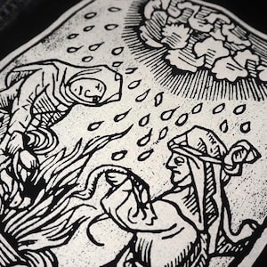 May include: Black and white illustration depicting a scene with figures, rain, and flames. A robed figure descends from above, while another figure below appears to be holding a snake. The artwork has a vintage, woodcut style.