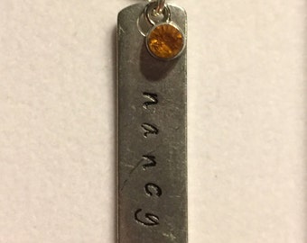 Hand stamped necklace with name and birthstone.