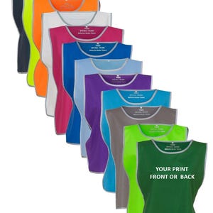 May include: A collection of eleven sleeveless tabards in various colors including black, neon yellow, orange, white, pink, blue, purple, turquoise, gray, light green, and dark green. Each tabard features a reflective silver border and text.