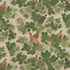 May include: A repeating pattern of green leafy branches and colorful birds. The birds are brown, red, yellow, and black with white spots. The background is a light cream color.