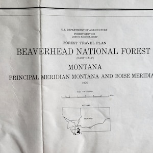 May include: A black and white map of Montana showing the location of the Beaverhead National Forest. The map is titled "Forest Travel Plan Beaverhead National Forest (East Half)" and includes the text "Principal Meridian Montana and Boise Meridian 1976".