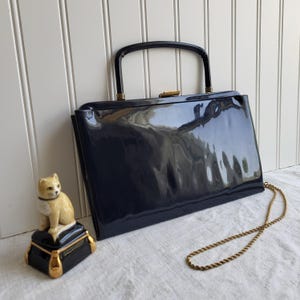 May include: A rustic wooden sign with the text "Welcome to our home" in white lettering. The sign features a distressed finish and a simple, inviting design, perfect for entryway decor.