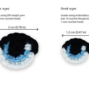 May include: Two crocheted eyes, one large and one small, with black, white, and light blue yarn. The large eye measures 1.7 inches by 2 inches, and the small eye measures 1 inch by 1.2 inches.