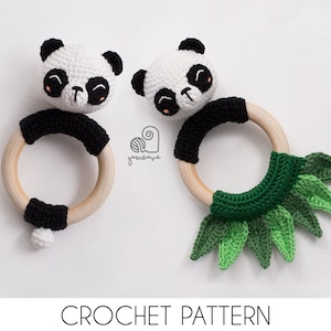 May include: Two crocheted panda rattle toys. One has a black and white panda head and a wooden ring with black crocheted trim. The other has a green crocheted leaf design.