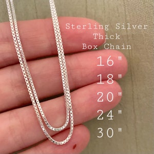 May include: Close-up of two sterling silver thick box chains. The image shows the chain lengths: 16", 18", 20", 24", and 30". The text "Sterling Silver Thick Box Chain" is also visible.