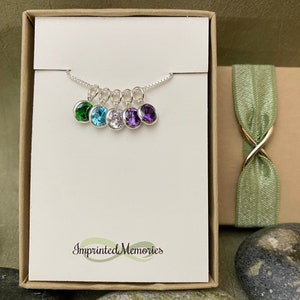 Necklace shown with 5 birthstones on one chain.