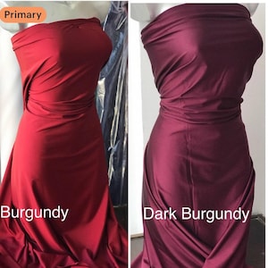 May include: Two fabric swatches, one in burgundy and the other in dark burgundy, are draped over mannequins. The burgundy swatch is a vibrant red-violet, while the dark burgundy is a deeper, richer shade of the same color. The word "Burgundy" and "Dark Burgundy" are printed on the image.