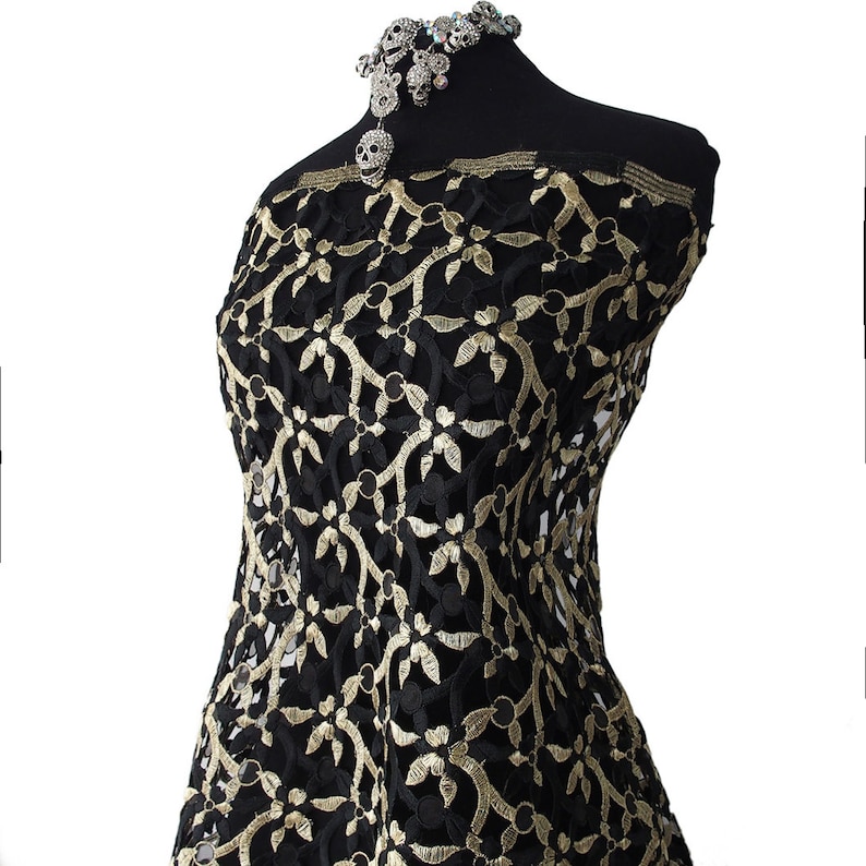 Facsinating gold light weight guipure design sold by the yard main image 0