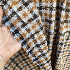 Check pattern wool suiting, boucle wool earth tones, Women’s check wool suiting Dormeuil made in France