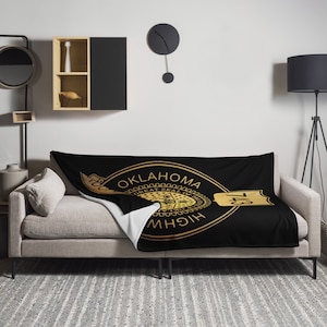 May include: Black and gold throw blanket with the Oklahoma state seal and "Oklahoma Highway 743" text.