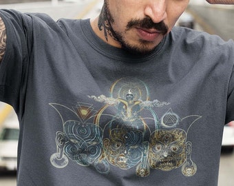 May include: Dark gray crew neck t-shirt featuring a detailed graphic of three stylized faces with intricate designs and a central figure. The artwork incorporates geometric shapes and a celestial theme.