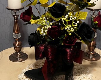 black cowboy boot flower arrangement with bow