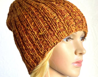 May include: A warm, orange and brown knitted beanie hat with a ribbed texture.