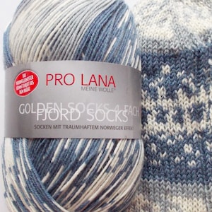 May include: A ball of blue and white yarn with a Norwegian pattern. The yarn is labelled "Pro Lana Meine Wolle" and "Golden Fjord Socks 4fach". The label also says "Socken mit traumhaftem Norweger Effekt".
