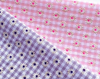 33" Lavender cotton check with white flocked flower motif. 45”