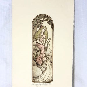 May include: An illustration of a woman in a pink dress sitting on rocks near a stream, holding a flower. The artwork is framed by an arched border with a tree at the top. The text at the bottom reads "The Lady Hope by A. Sweet 1982."